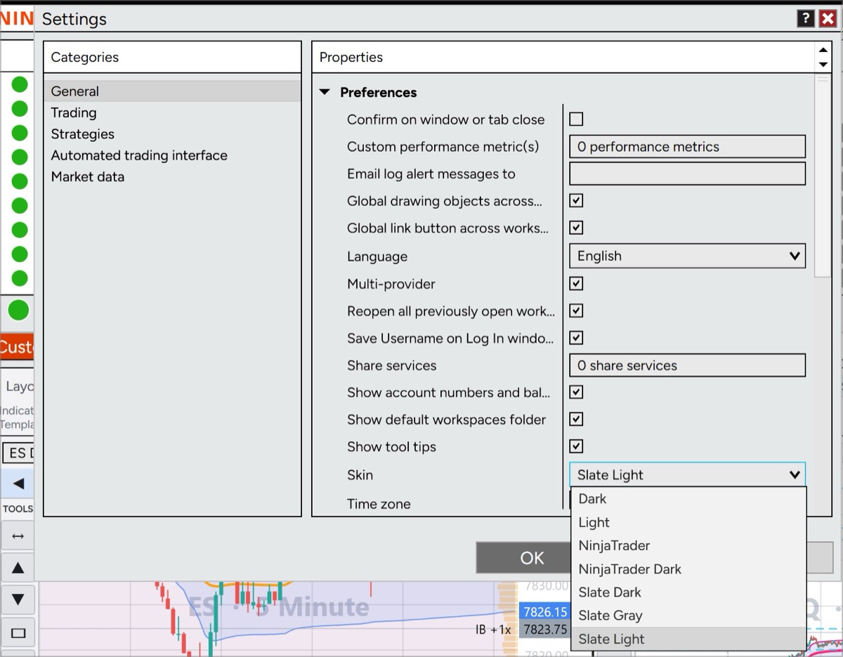 The NinjaTrader Settings dialog on the General category, with the Skin dropdown open showing Dark, Light, NinjaTrader, NinjaTrader Dark, Slate Dark, Slate Gray and Slate Light